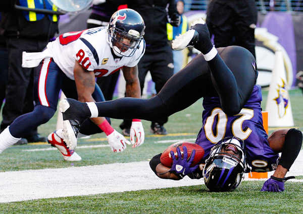 On Sunday, the Texans' Ed Reed (right) returns to Baltimore, where he spent 11 seasons.
